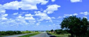 an image of highway under a blue sky