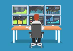 illustrated image of a person sitting in front of six monitors displaying illustrated charts